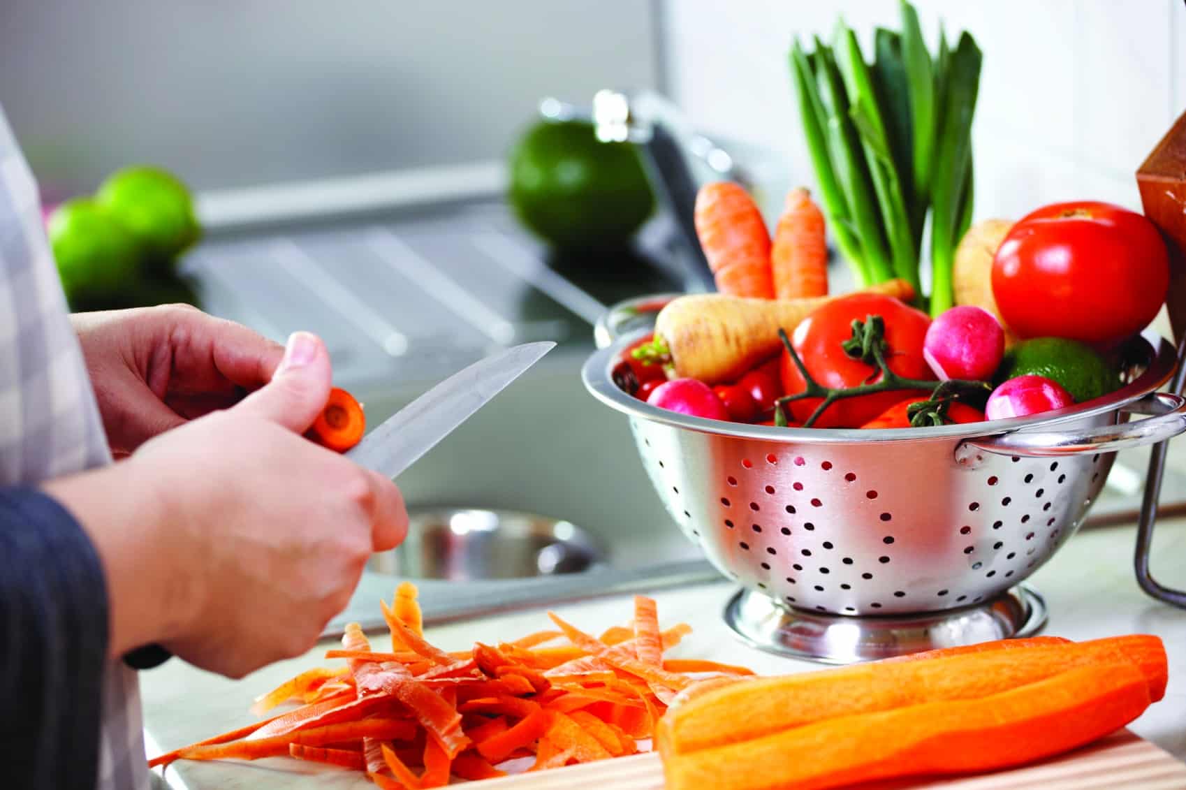 Chopping Fresh Vegetables In Kitchen