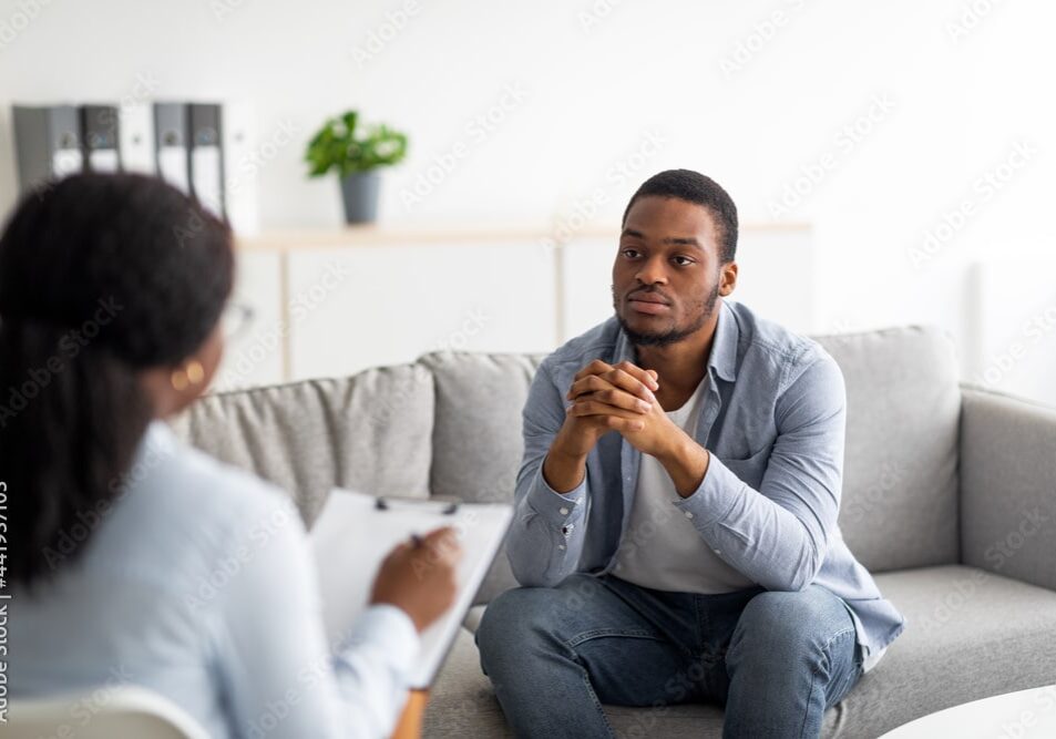 man talking with a counselor